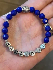 50% Donated to Harris 2024, blue and silver KAMALA '24 stretch bracelet.